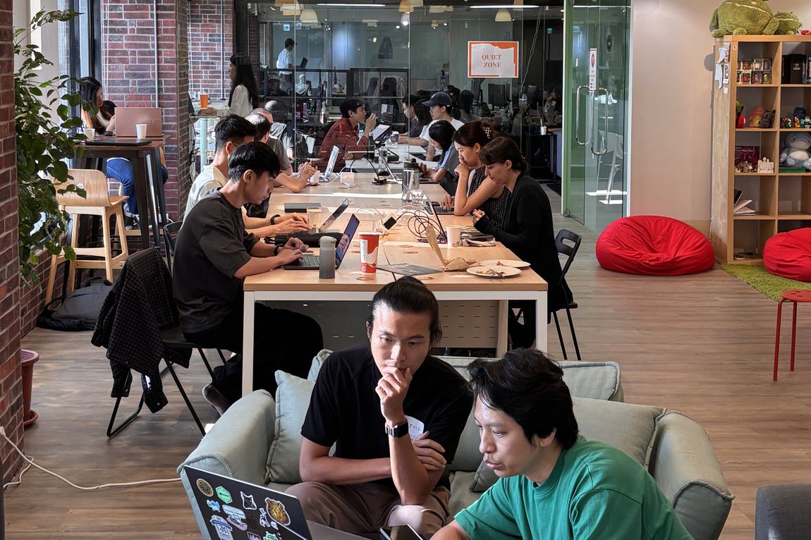 Members working on the Day 1 coworking floor